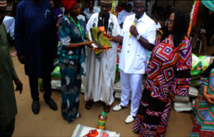 Widow receiving item from Ministry