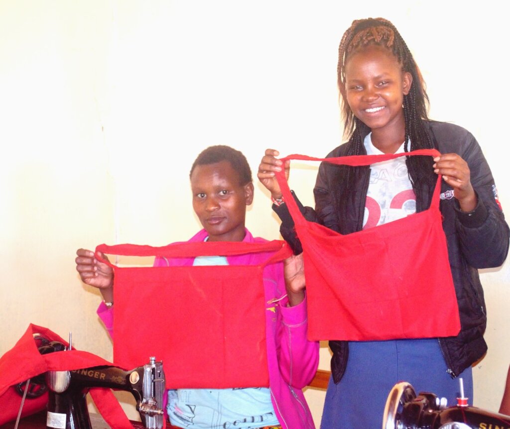 Happy faces of women in sewing class