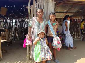 One of our handcraft women and her girls