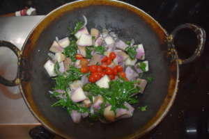 Delicious yam, tomatoes, and greens ready to eat!