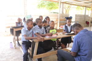 Students listen to a lecture at Source Divine