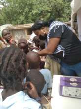 De-worming children at the IDP Camp