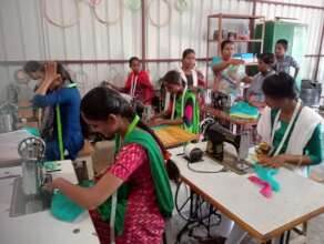 Trainees at work on sewing machines