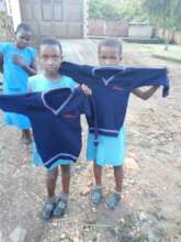 Nina and Evas display their new sweaters.