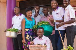 CFU Uganda staff harvesting vegetables