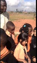 Students and teacher watching the volcano erupt