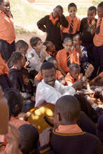 A BeeHive Teacher leads a singing session