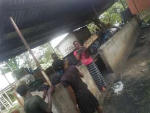 The girls extruding briquettes at a session