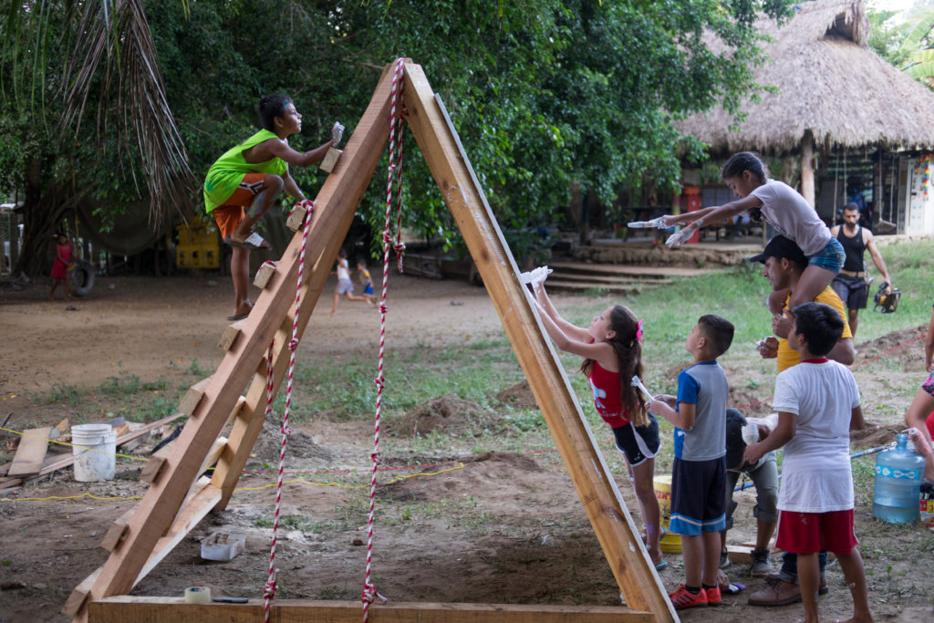 Children helping to build a playground in Mexico