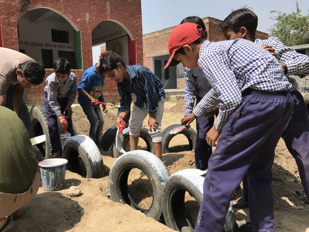 Building a playground with children help in India