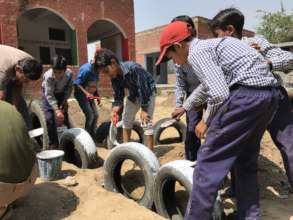 Building a playground with children help in India