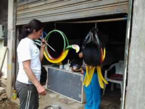 women painting handicrafts