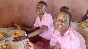 Canteen students enjoy their meal while sitting