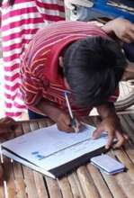 Child signing to receive school materials.