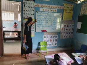 Srey Na is learning with other children in EFC