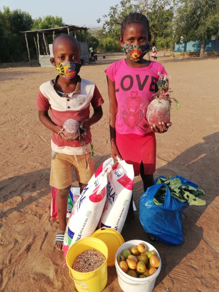 Providing food baskets to students in Mozambique