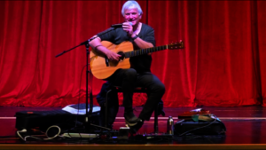 LJ on stage at Hoover High School