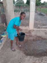 refugee child watering the garden