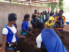 Student making compost