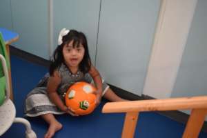 A child enjoying her Physical Therapy session