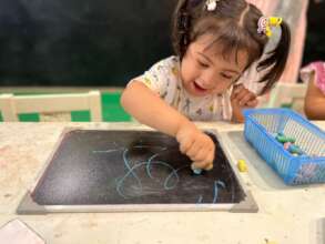 A child enjoying her day at the Sparks Play Center