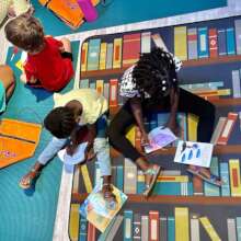 Kids doing crafts for GLRW event at the VICM