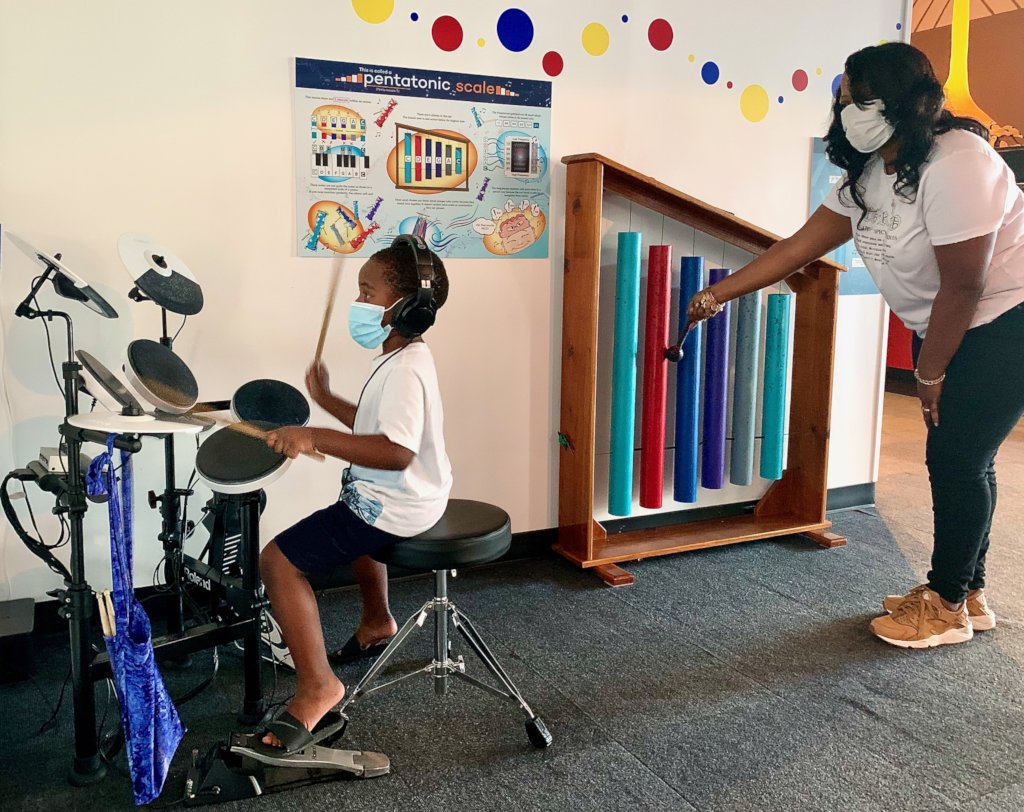 Music Exploration Corner, mom & son making music