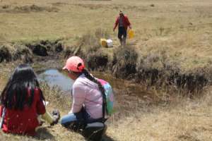 Children by a rural wetland, close to Lake Tota
