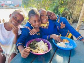 Children enjoying their meal at Nourish