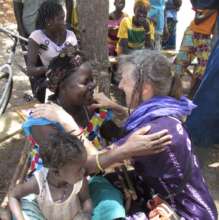 Ina and Bempoua in an embrace of reciprocity.