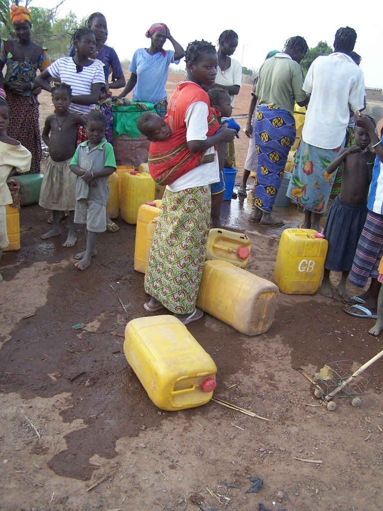 Women waiting for water, a daily ritual.