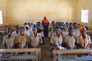 Madame Zalle in class with her girl students