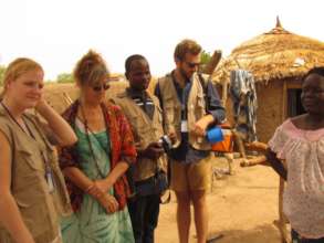 Ina and team speak to a water committee member