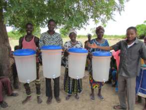 Our first four filter customers in a village