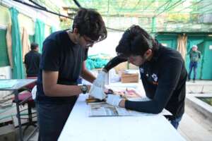 Team is cleaning the glue with baby oil