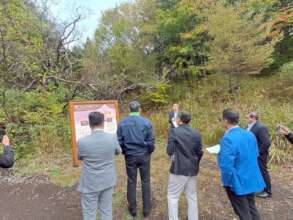 Project signboard explaining goals & partnerships