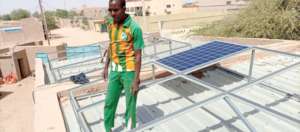 Installing solar panels at the Learning Center