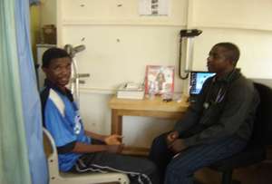 Mohamed with Philip Sesay, GGM Clinic Director