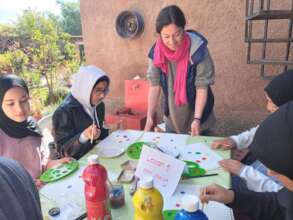 The girls love to do art activities in the garden