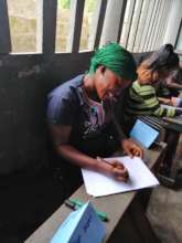Adult Literacy Program student writing activity