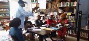 WE-CARE Exec. Director working with ALP teachers