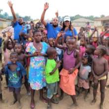 Ibrahim John and Abeni with the orphans