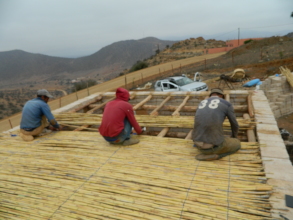 Community members joining effort to Lay the roof