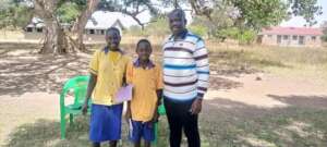 Norah receiving Books and pens