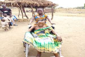 Mary being wheeled by her daughter