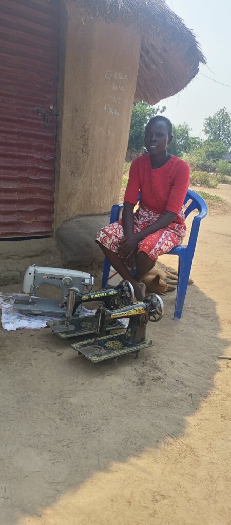 Viola at her home showing the three sewing machine
