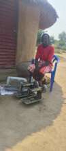 Viola at her home showing the three sewing machine