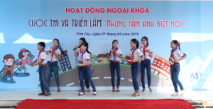 Students present their photo entries on stage