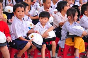 Students at Pham Van Chieu school with new helmets