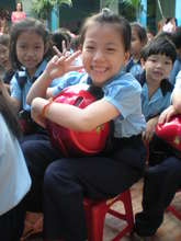 Student hugs her new helmet